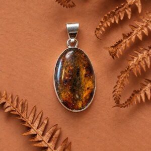 Pendentif ovale en argent 925 avec cabochon d ambre veritable de Pologne couleur cognac et miel
